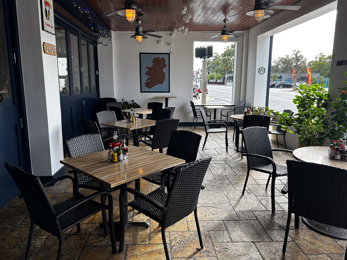 outdoor seating with dark brown tables and chairs